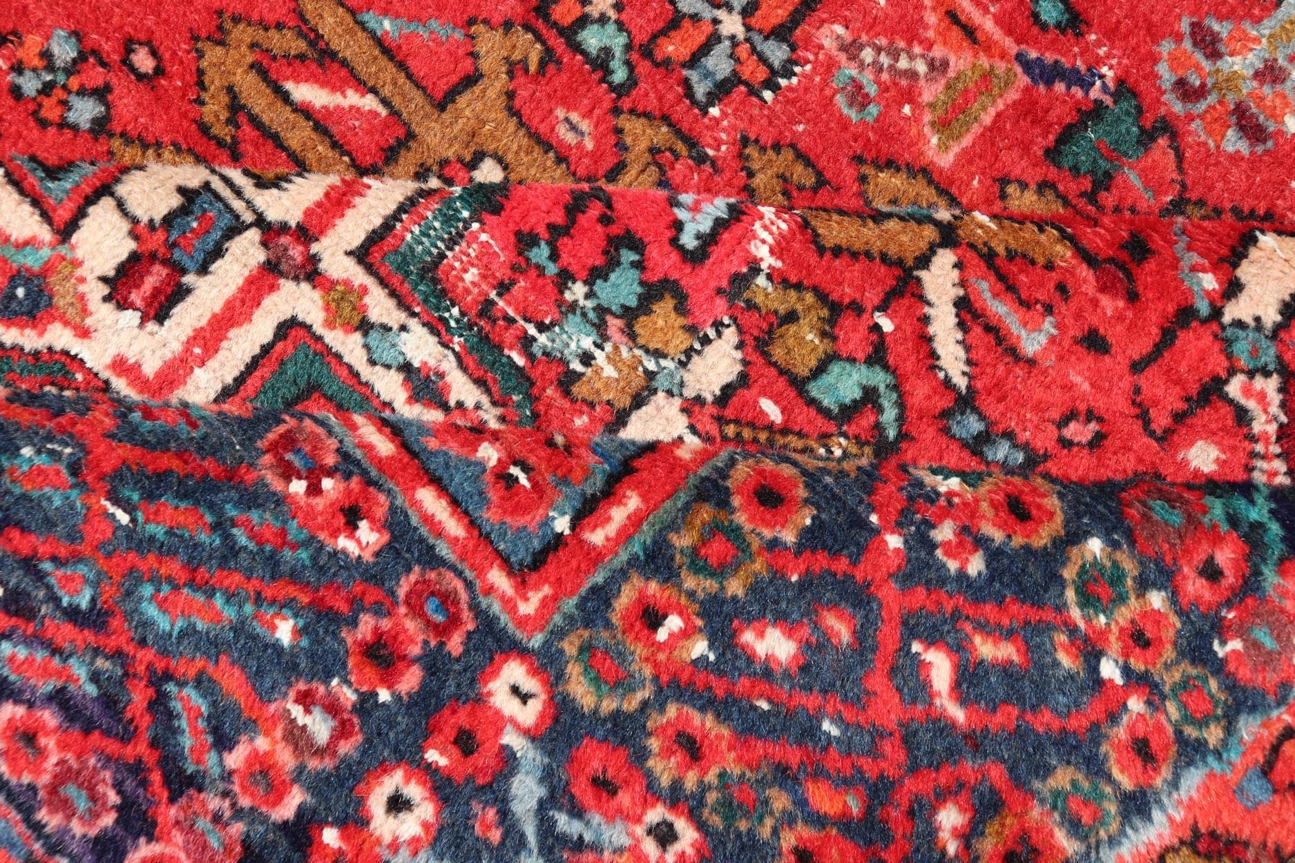 Vintage Persian Karajeh - Heriz Gallery with Geometric Medallions On A Red Ground. Keivan Woven Arts , rug X23 - 0109, country of origin / type: Persian / Heriz - Karajeh, circa mid - 20th century. Measures: 5'0 x 12'4 This gallery rug incorporates a di... - Keivan Woven ArtsX23 - 0109 - 24354Rug