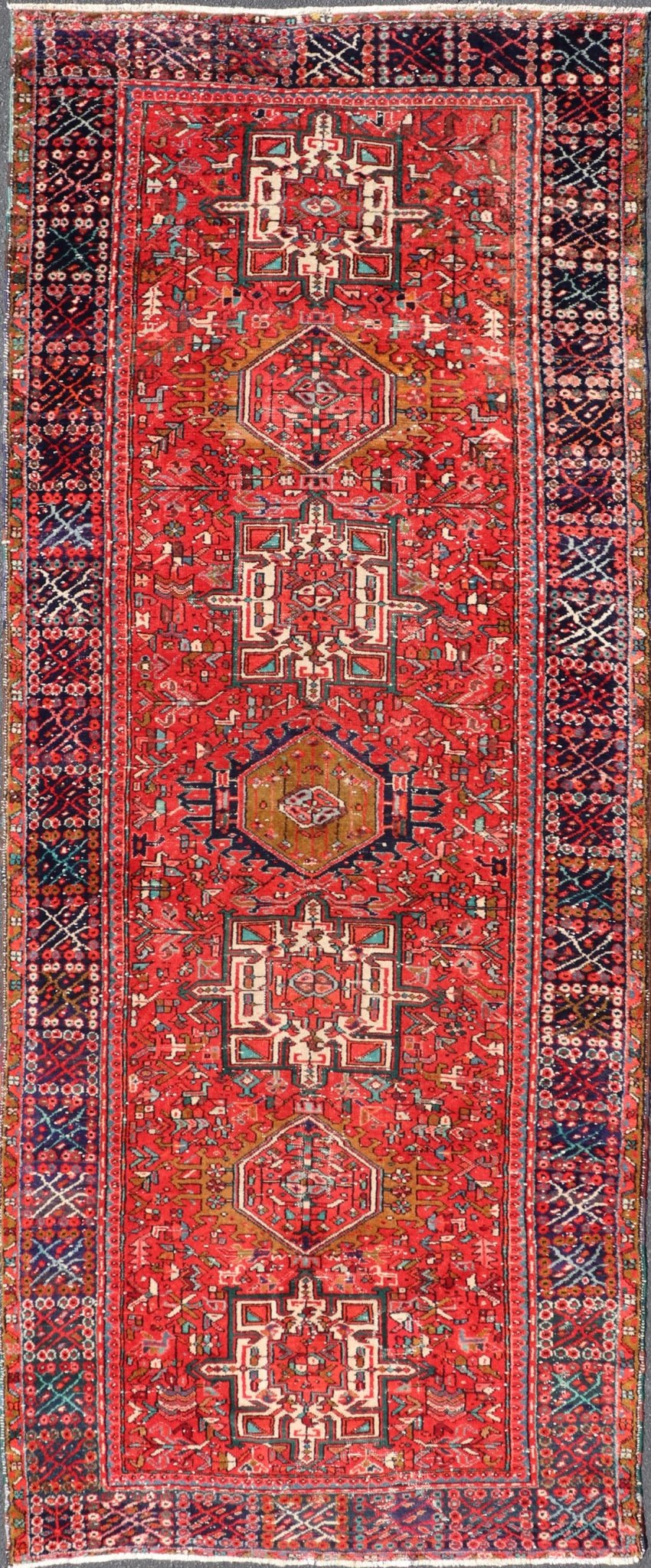 Vintage Persian Karajeh - Heriz Gallery with Geometric Medallions On A Red Ground. Keivan Woven Arts , rug X23 - 0109, country of origin / type: Persian / Heriz - Karajeh, circa mid - 20th century. Measures: 5'0 x 12'4 This gallery rug incorporates a di... - Keivan Woven ArtsX23 - 0109 - 24354Rug