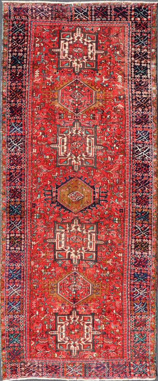 Vintage Persian Karajeh - Heriz Gallery with Geometric Medallions On A Red Ground. Keivan Woven Arts , rug X23 - 0109, country of origin / type: Persian / Heriz - Karajeh, circa mid - 20th century. Measures: 5'0 x 12'4 This gallery rug incorporates a di... - Keivan Woven ArtsX23 - 0109 - 24354Rug