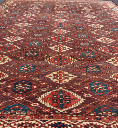Early 19th century Chodor main carpet from Turkmenistan Antique Turkomen Rug in Wool with Repeating Gul Design in Brown, Blue, and Red. Keivan Woven Arts; rug X23 - 0306 - 201, country of origin / type: Turkestan / Turkomen circa 1820s. Measure... - Keivan Woven ArtsX23 - 0306 - 201 - 23547