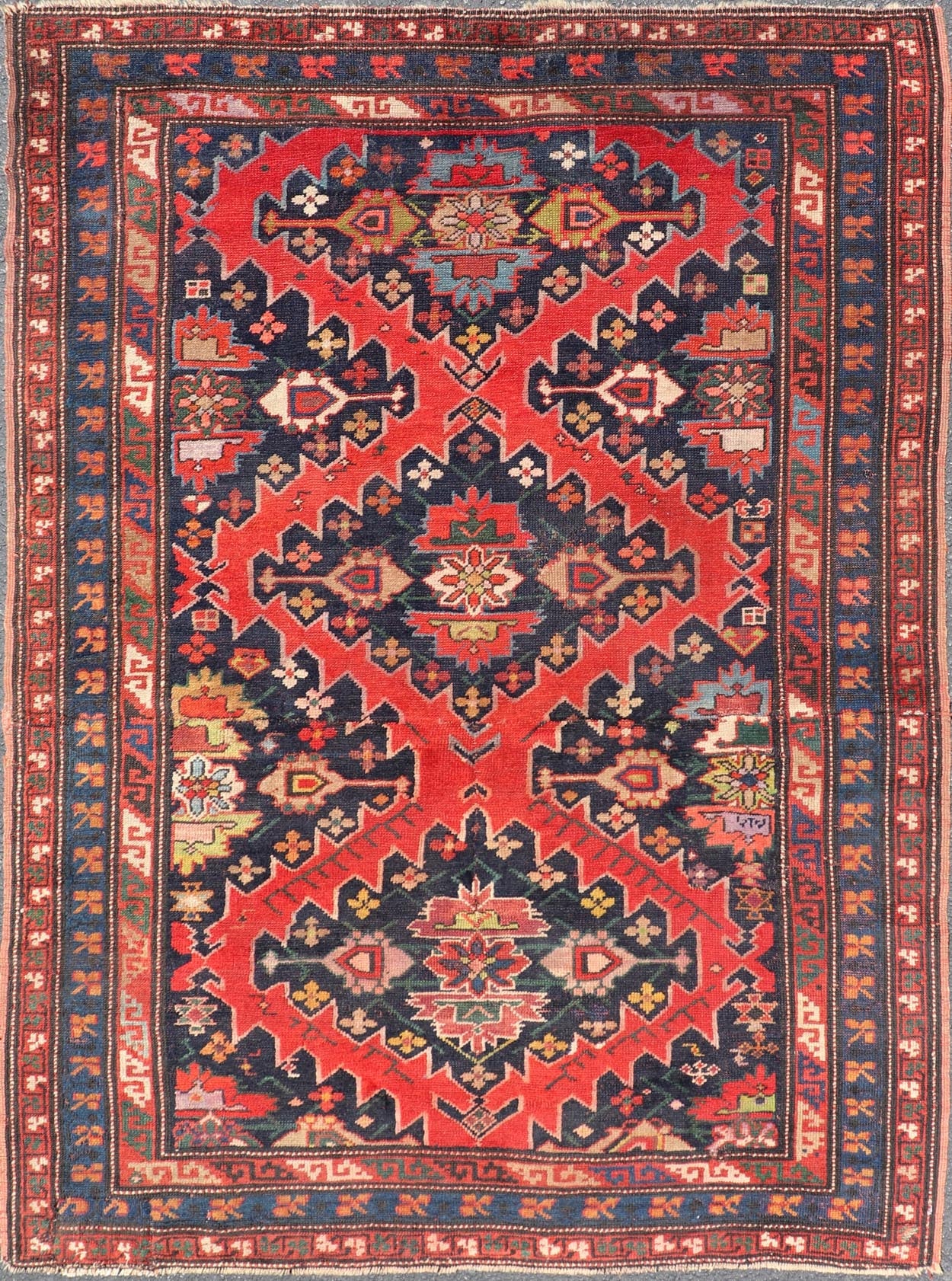 Antique Caucasian Kazak Rug with Sub - Geometric Medallions Design in Red and Blue. Keivan Woven Arts / rug X23 - 0405 - 259, country of origin / type: Caucasus / Kazak, circa Late - 19th Century. Antique Caucasian Kazak Rug with Sub - Geometric Medallions Desig... - Keivan Woven ArtsX23 - 0405 - 259 - 24283