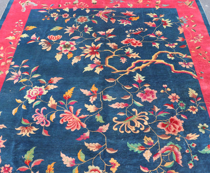 Blue Background Chinese Art Deco Rug with Large Vining Flowers and Leaves. Keivan Woven Arts / rug X23 - 0603, country of origin / type: China / Art Deco, circa 1920. Measures: 9'0 x 11'4 Alive with color, this beautiful antique Art Deco Chinese r... - Keivan Woven ArtsX23 - 0603 - 24486Rug