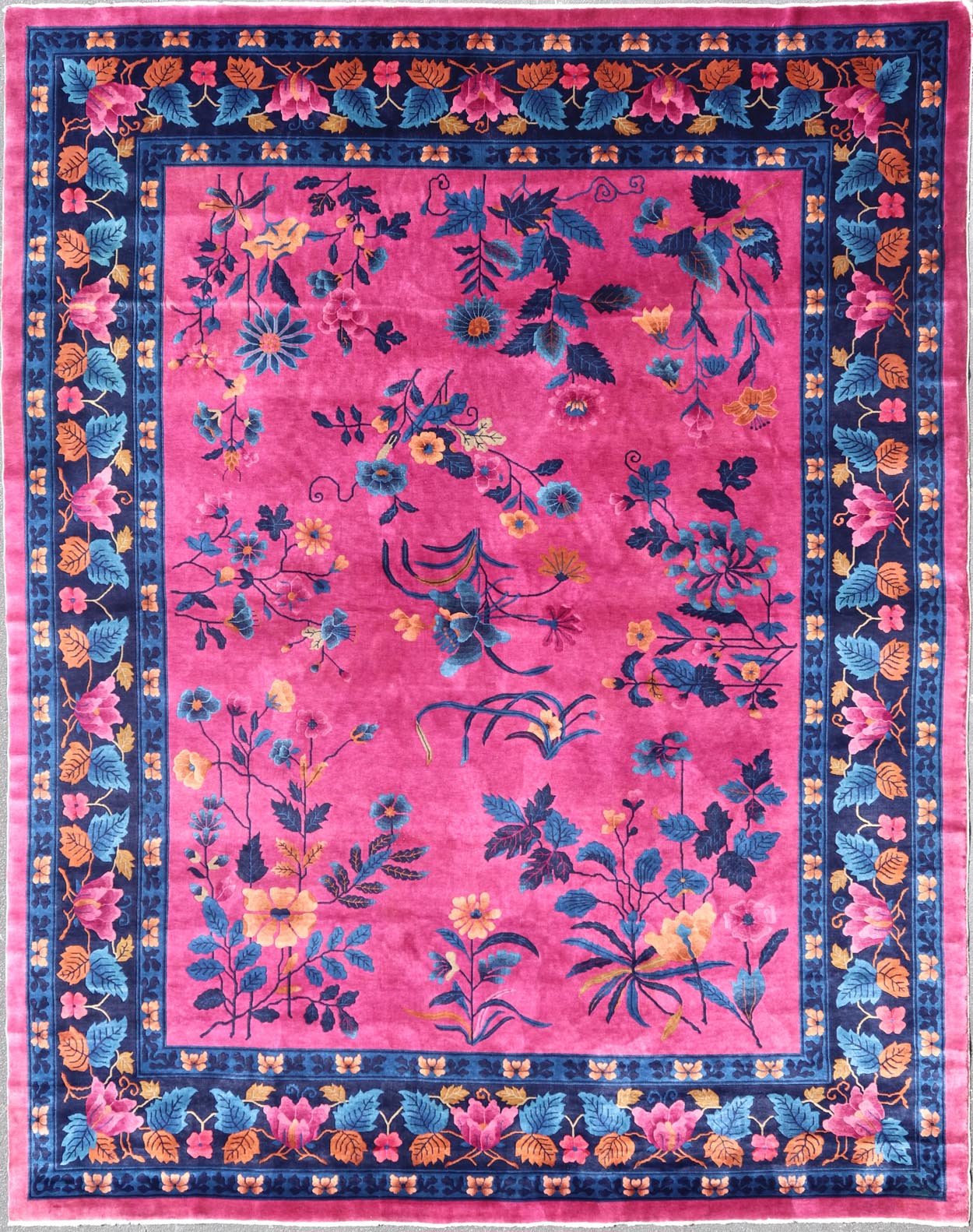Magenta Background Chinese Art Deco Rug with Large Vining Flowers and Leaves. Keivan Woven Arts / rug X23 - 0802, country of origin / type: China / Art Deco, circa 1920. Measures: 12'0 x 14'8 Alive with color, this beautiful antique Art Deco Chine... - Keivan Woven ArtsX23 - 0802 - 24964Rug