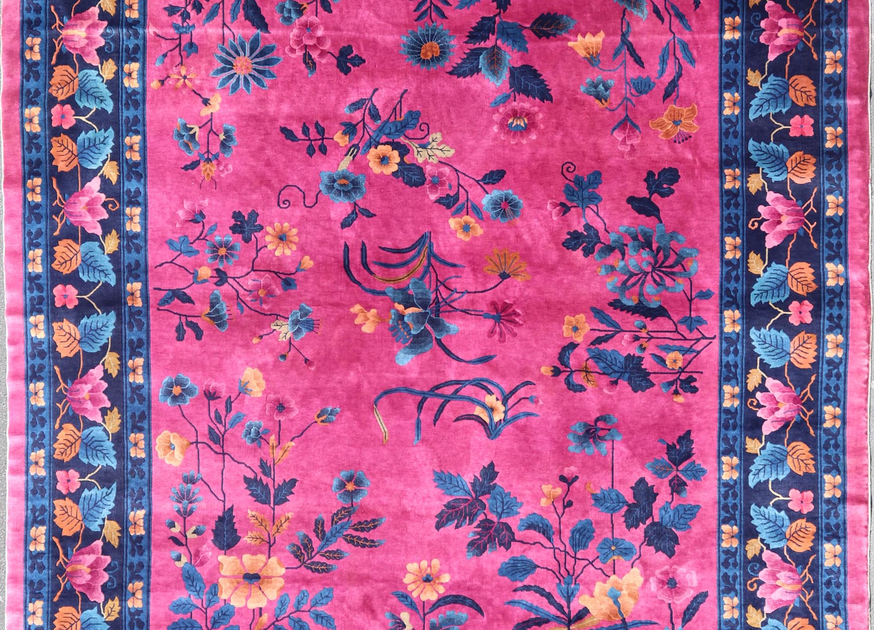 Magenta Background Chinese Art Deco Rug with Large Vining Flowers and Leaves. Keivan Woven Arts / rug X23 - 0802, country of origin / type: China / Art Deco, circa 1920. Measures: 12'0 x 14'8 Alive with color, this beautiful antique Art Deco Chine... - Keivan Woven ArtsX23 - 0802 - 24964Rug