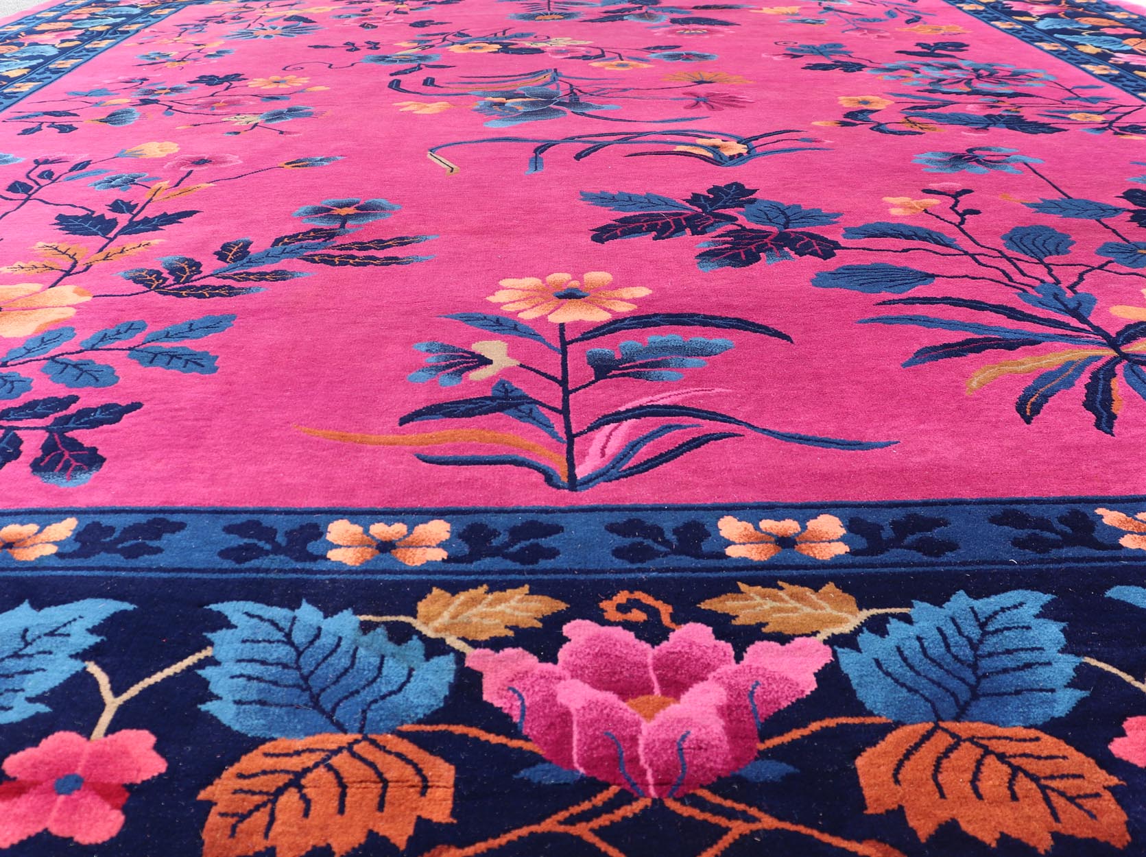 Magenta Background Chinese Art Deco Rug with Large Vining Flowers and Leaves. Keivan Woven Arts / rug X23 - 0802, country of origin / type: China / Art Deco, circa 1920. Measures: 12'0 x 14'8 Alive with color, this beautiful antique Art Deco Chine... - Keivan Woven ArtsX23 - 0802 - 24964Rug