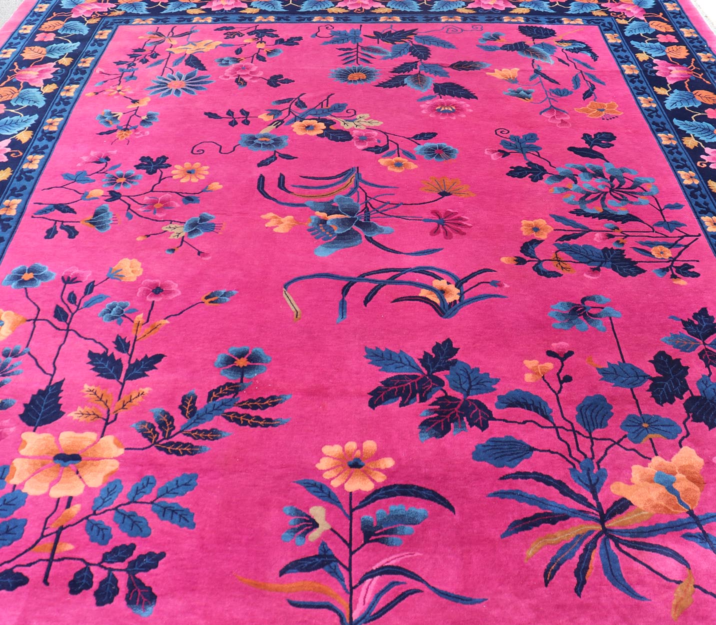 Magenta Background Chinese Art Deco Rug with Large Vining Flowers and Leaves. Keivan Woven Arts / rug X23 - 0802, country of origin / type: China / Art Deco, circa 1920. Measures: 12'0 x 14'8 Alive with color, this beautiful antique Art Deco Chine... - Keivan Woven ArtsX23 - 0802 - 24964Rug