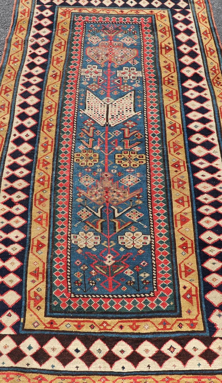 Antique Caucasian Shirvan Rug with Tribal Design and Motifs in Vivid Colors. Keivan Woven Arts / rug X23 - 0810 - 55, country of origin / type: Caucasus / Shirvan, circa 1875. Measures: 3'9 x 7'10 A finely woven Shirvan Caucasian rug. The field desi... - Keivan Woven ArtsX23 - 0810 - 55 - 24849Rug