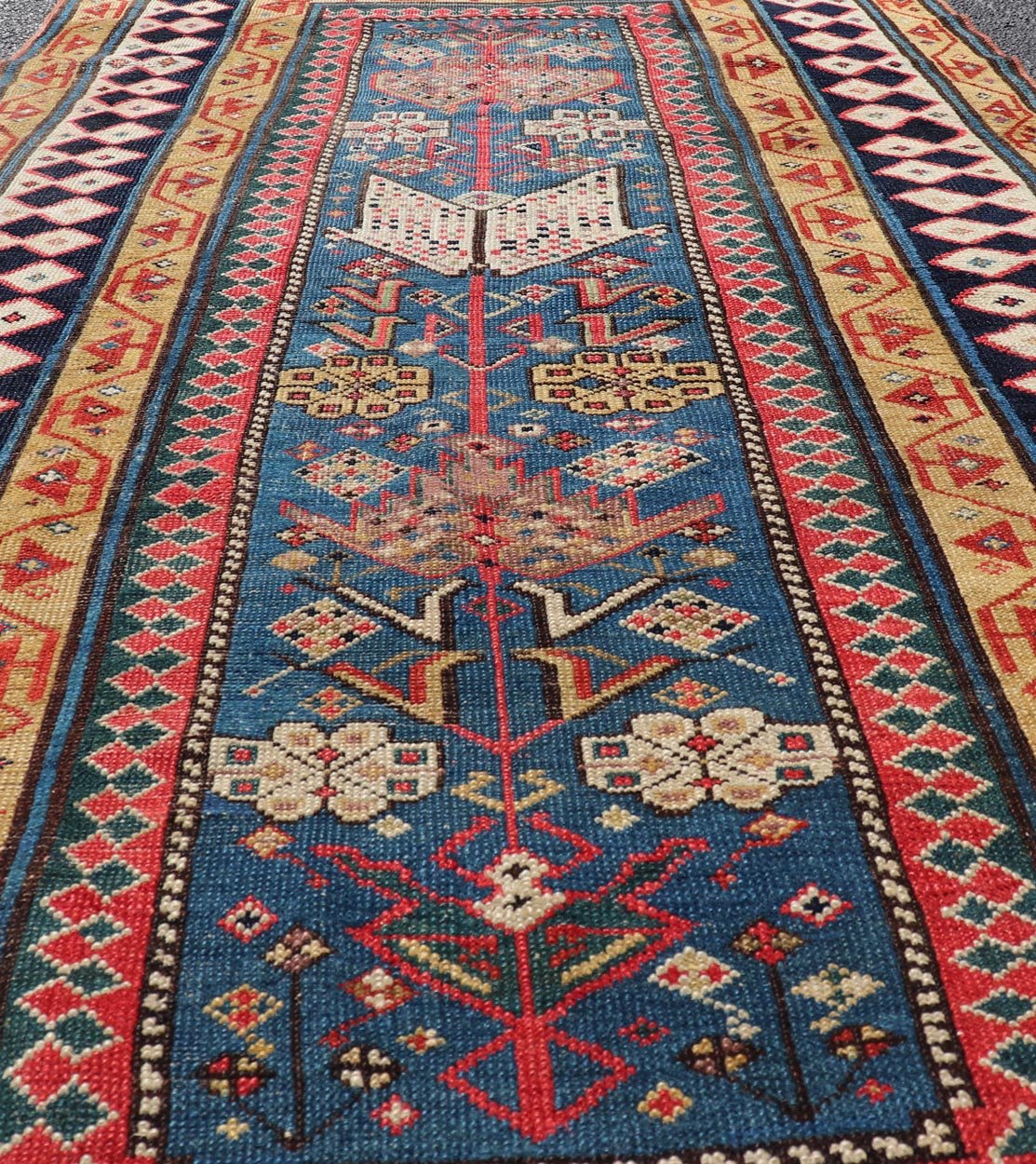 Antique Caucasian Shirvan Rug with Tribal Design and Motifs in Vivid Colors. Keivan Woven Arts / rug X23 - 0810 - 55, country of origin / type: Caucasus / Shirvan, circa 1875. Measures: 3'9 x 7'10 A finely woven Shirvan Caucasian rug. The field desi... - Keivan Woven ArtsX23 - 0810 - 55 - 24849Rug
