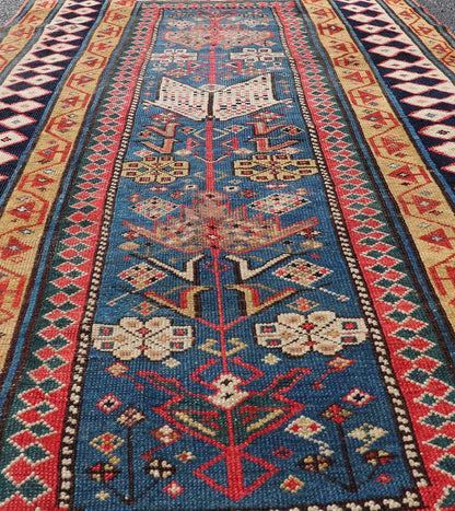 Antique Caucasian Shirvan Rug with Tribal Design and Motifs in Vivid Colors. Keivan Woven Arts / rug X23 - 0810 - 55, country of origin / type: Caucasus / Shirvan, circa 1875. Measures: 3'9 x 7'10 A finely woven Shirvan Caucasian rug. The field desi... - Keivan Woven ArtsX23 - 0810 - 55 - 24849Rug