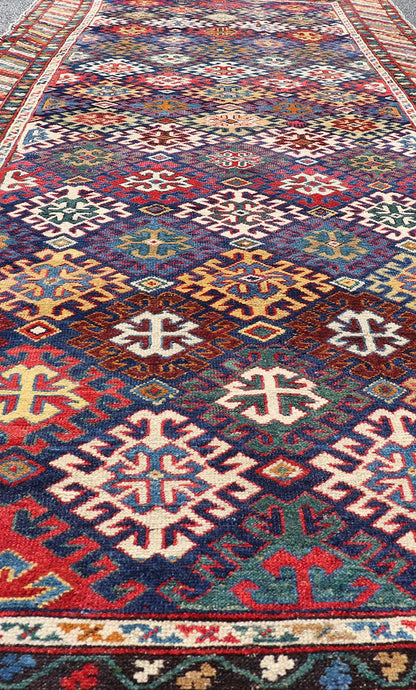 Antique Caucasian Kuba Gallery Runner with Tribal Design and All - Over Motifs. Keivan Woven Arts / rug X23 - 0811 - 79, country of origin / type: Caucasus / Shirvan, circa 1890. Measures: 4'0 x 10'6 The field design of this antique Caucasian Kuba ga... - Keivan Woven ArtsX23 - 0811 - 79 - 24855