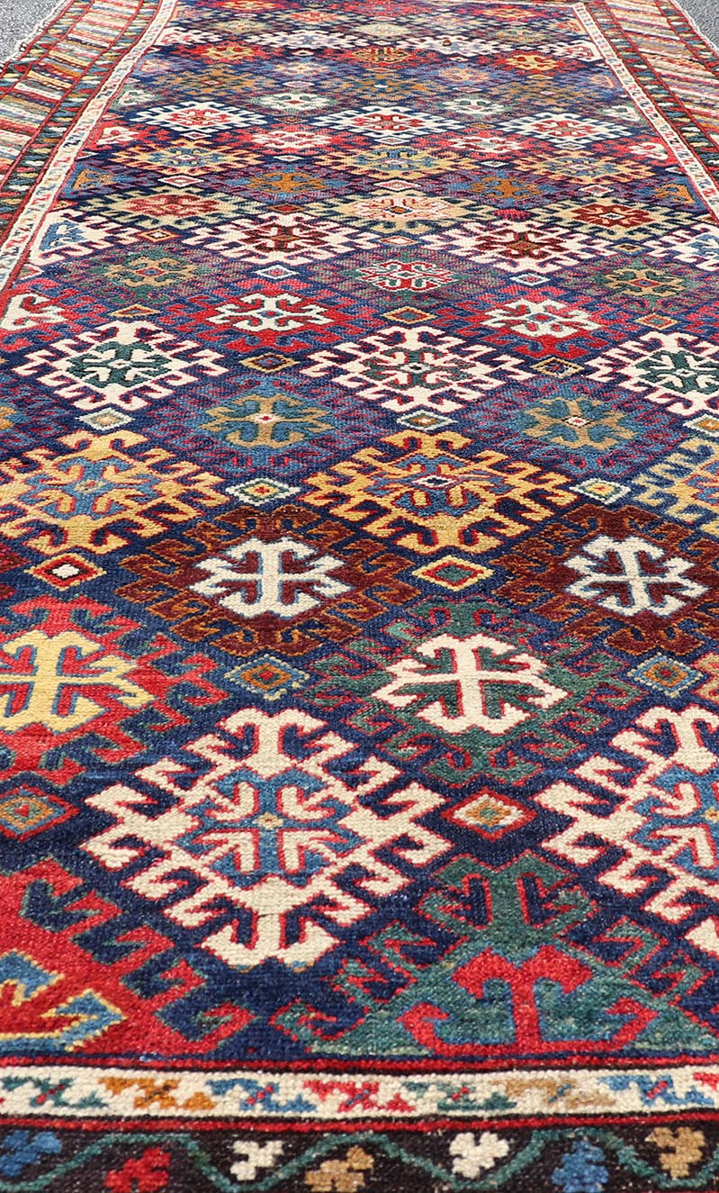 Antique Caucasian Kuba Gallery Runner with Tribal Design and All - Over Motifs. Keivan Woven Arts / rug X23 - 0811 - 79, country of origin / type: Caucasus / Shirvan, circa 1890. Measures: 4'0 x 10'6 The field design of this antique Caucasian Kuba ga... - Keivan Woven ArtsX23 - 0811 - 79 - 24855Rug