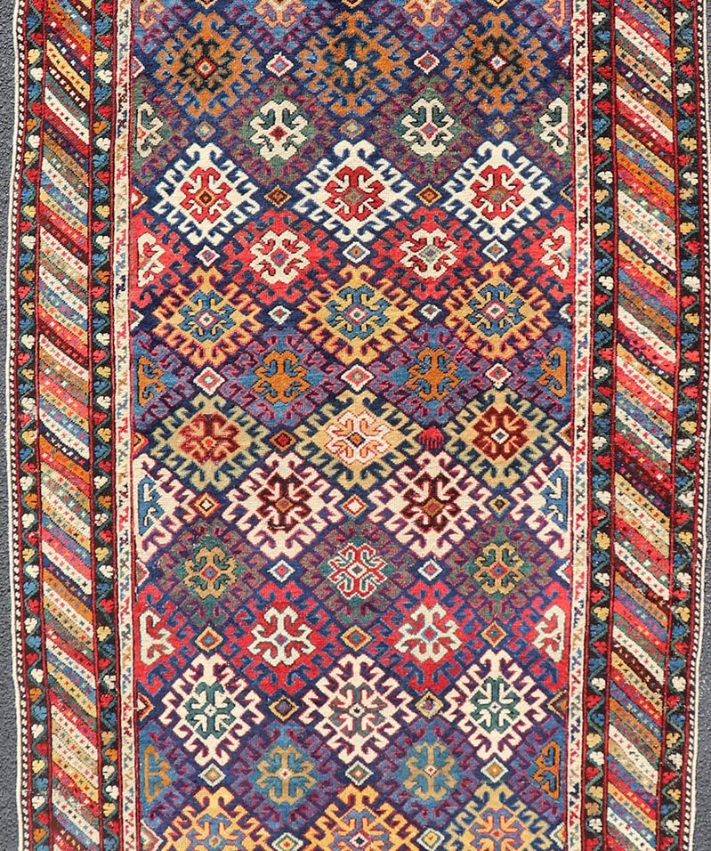 Antique Caucasian Kuba Gallery Runner with Tribal Design and All - Over Motifs. Keivan Woven Arts / rug X23 - 0811 - 79, country of origin / type: Caucasus / Shirvan, circa 1890. Measures: 4'0 x 10'6 The field design of this antique Caucasian Kuba ga... - Keivan Woven ArtsX23 - 0811 - 79 - 24855