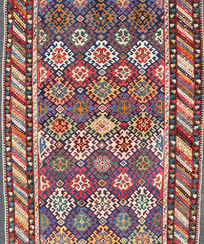 Antique Caucasian Kuba Gallery Runner with Tribal Design and All - Over Motifs. Keivan Woven Arts / rug X23 - 0811 - 79, country of origin / type: Caucasus / Shirvan, circa 1890. Measures: 4'0 x 10'6 The field design of this antique Caucasian Kuba ga... - Keivan Woven ArtsX23 - 0811 - 79 - 24855