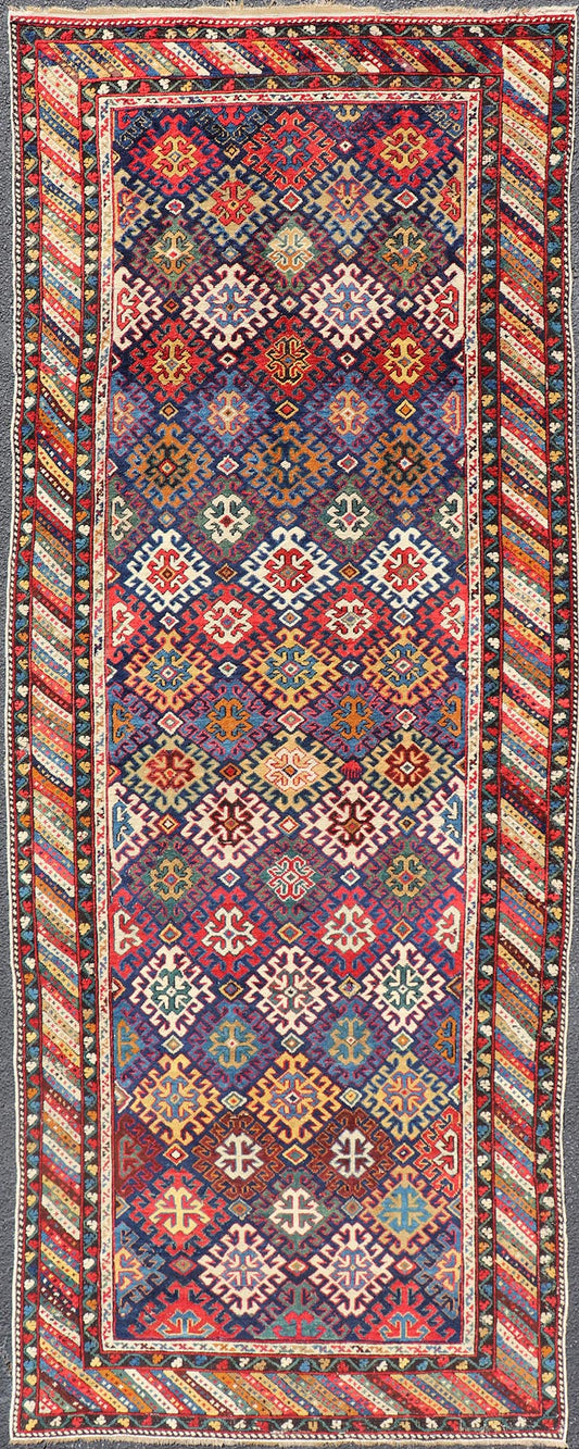 Antique Caucasian Kuba Gallery Runner with Tribal Design and All - Over Motifs. Keivan Woven Arts / rug X23 - 0811 - 79, country of origin / type: Caucasus / Shirvan, circa 1890. Measures: 4'0 x 10'6 The field design of this antique Caucasian Kuba ga... - Keivan Woven ArtsX23 - 0811 - 79 - 24855