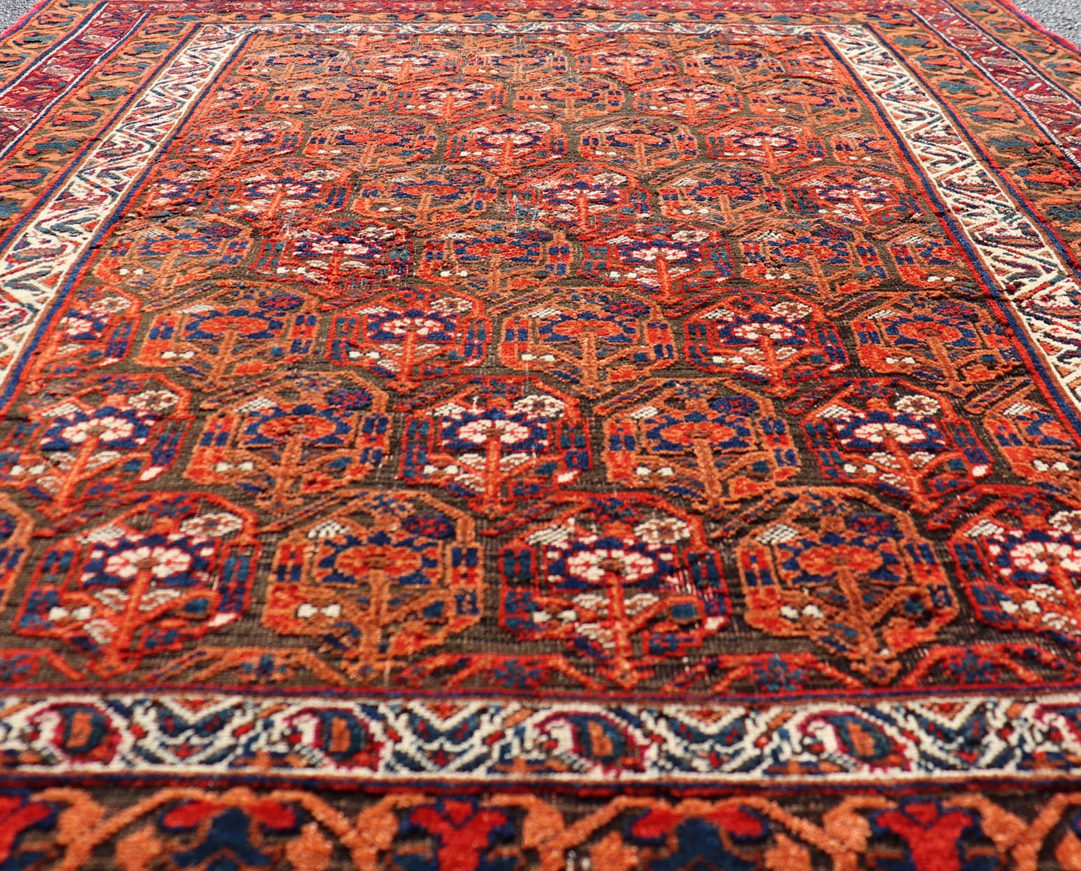 Fine Persian Antique Afshar Rug in Orange and Copper Background & Multi Colors. Keivan Woven Arts/ Rug/X23 - 0812 - 93, Antique Afshar Early 20th Century. Measures: 4'2 x 5'2 Unique Botanical, rich symbolism, and fine intricacy contribute to the ma... - Keivan Woven ArtsX23 - 0812 - 93 - 24813