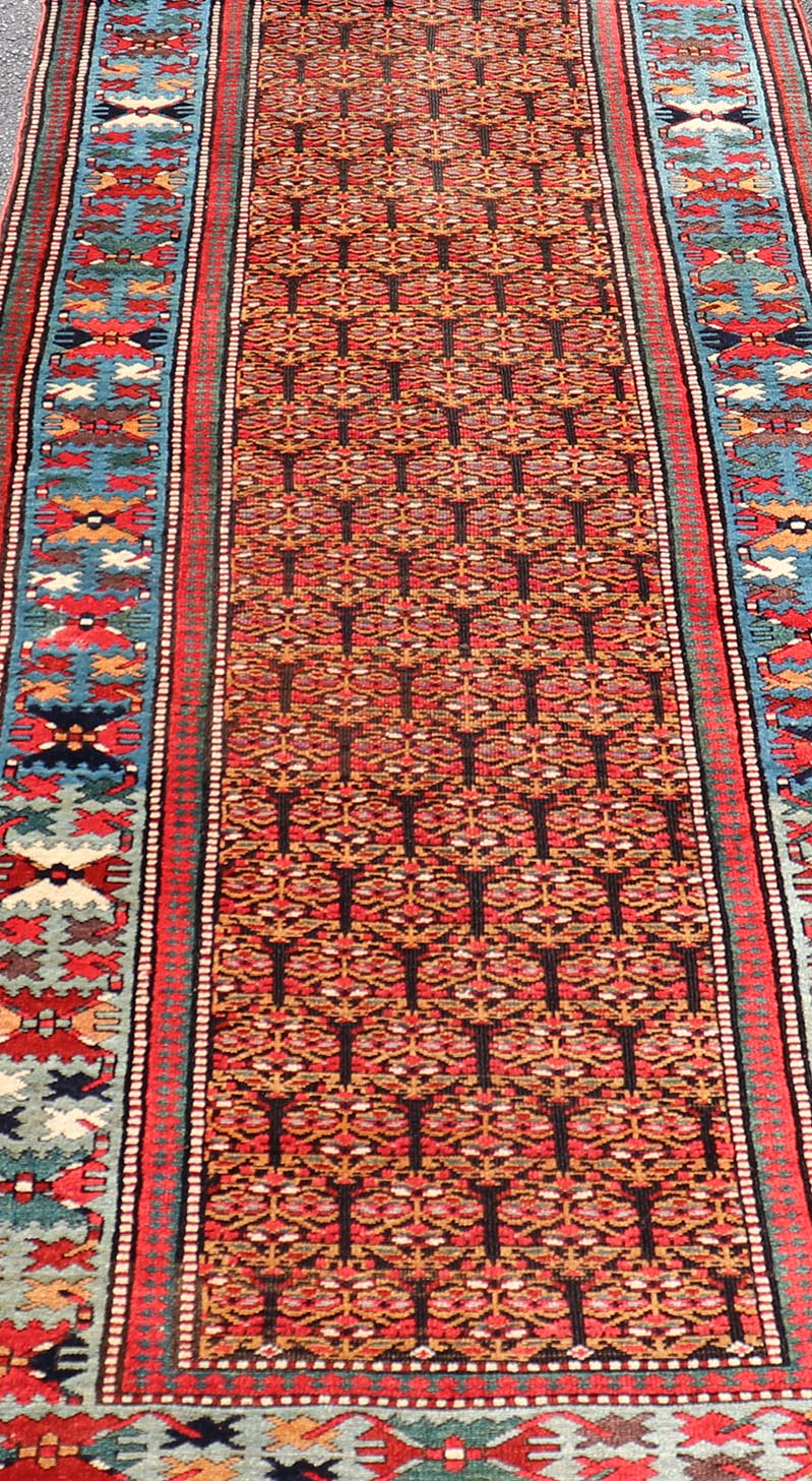 Antique Persian Kurdish Long Gallery Runner with Repeating Tribal Motif Design. Keivan Woven Arts; rug X23 - 0816 - 335; country of origin / type: Persian / Kurdish circa 1900. Measures: 3'5 x 14'9 This antique hand - knotted Persian Kurdish wide runn... - Keivan Woven ArtsX23 - 0816 - 335 - 24862Rug