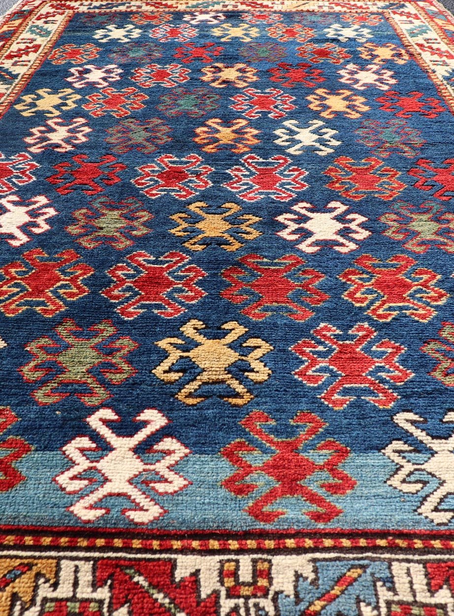Antique Caucasian Kazak Rug with Geometric And Tribal Motifs Keivan Woven Arts. Keivan Woven Arts / rug /X23 - 1201 - 169, country of origin / type: Caucasus / Kazak, circa 1875. Measures: 4'3 x 7'6 This late 19th - century treasure is rendered in bl... - Keivan Woven ArtsX23 - 1201 - 169 - 25619Rugs