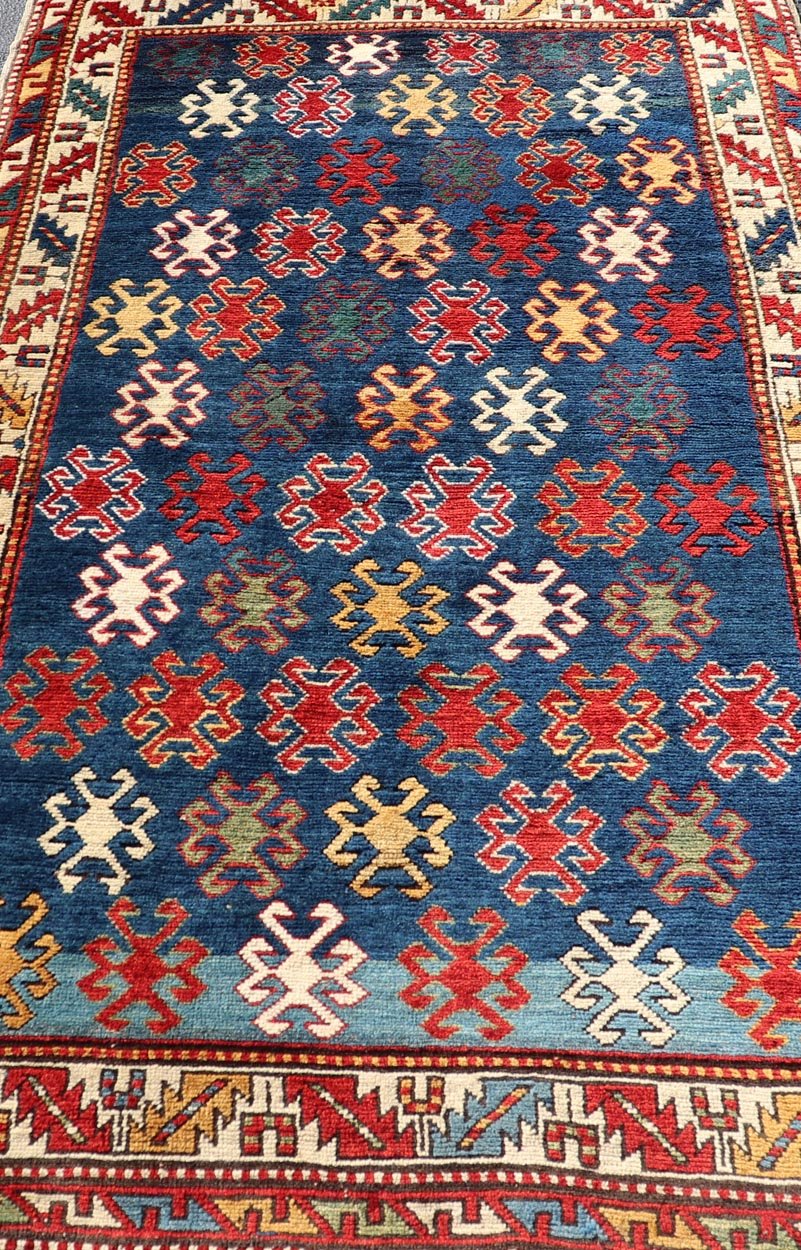 Antique Caucasian Kazak Rug with Geometric And Tribal Motifs Keivan Woven Arts. Keivan Woven Arts / rug /X23 - 1201 - 169, country of origin / type: Caucasus / Kazak, circa 1875. Measures: 4'3 x 7'6 This late 19th - century treasure is rendered in bl... - Keivan Woven ArtsX23 - 1201 - 169 - 25619Rugs