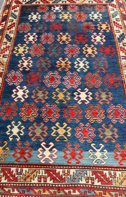 Antique Caucasian Kazak Rug with Geometric And Tribal Motifs Keivan Woven Arts. Keivan Woven Arts / rug /X23 - 1201 - 169, country of origin / type: Caucasus / Kazak, circa 1875. Measures: 4'3 x 7'6 This late 19th - century treasure is rendered in bl... - Keivan Woven ArtsX23 - 1201 - 169 - 25619Rugs