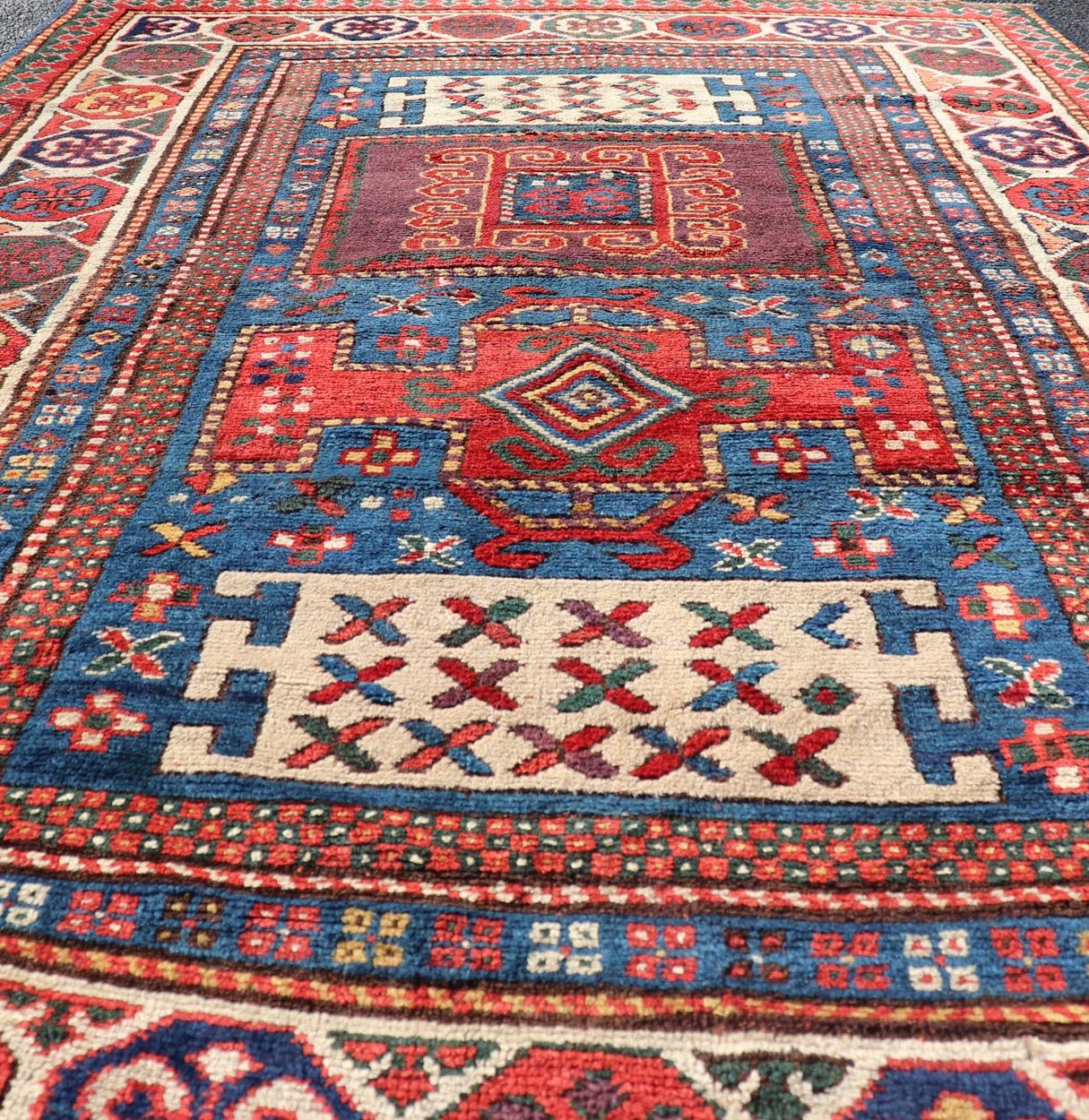 Antique Caucasian Kazak Rug with Geometrics Medallions Keivan Woven Arts. Keivan Woven Arts / rug X23 - 1204 - 188, country of origin / type: Caucasus late 19th Century. Measures: 4'4 x 7'0 Kazak rugs are among the most desirable Caucasian rugs. Th... - Keivan Woven ArtsX23 - 1204 - 188 - 25627Rugs