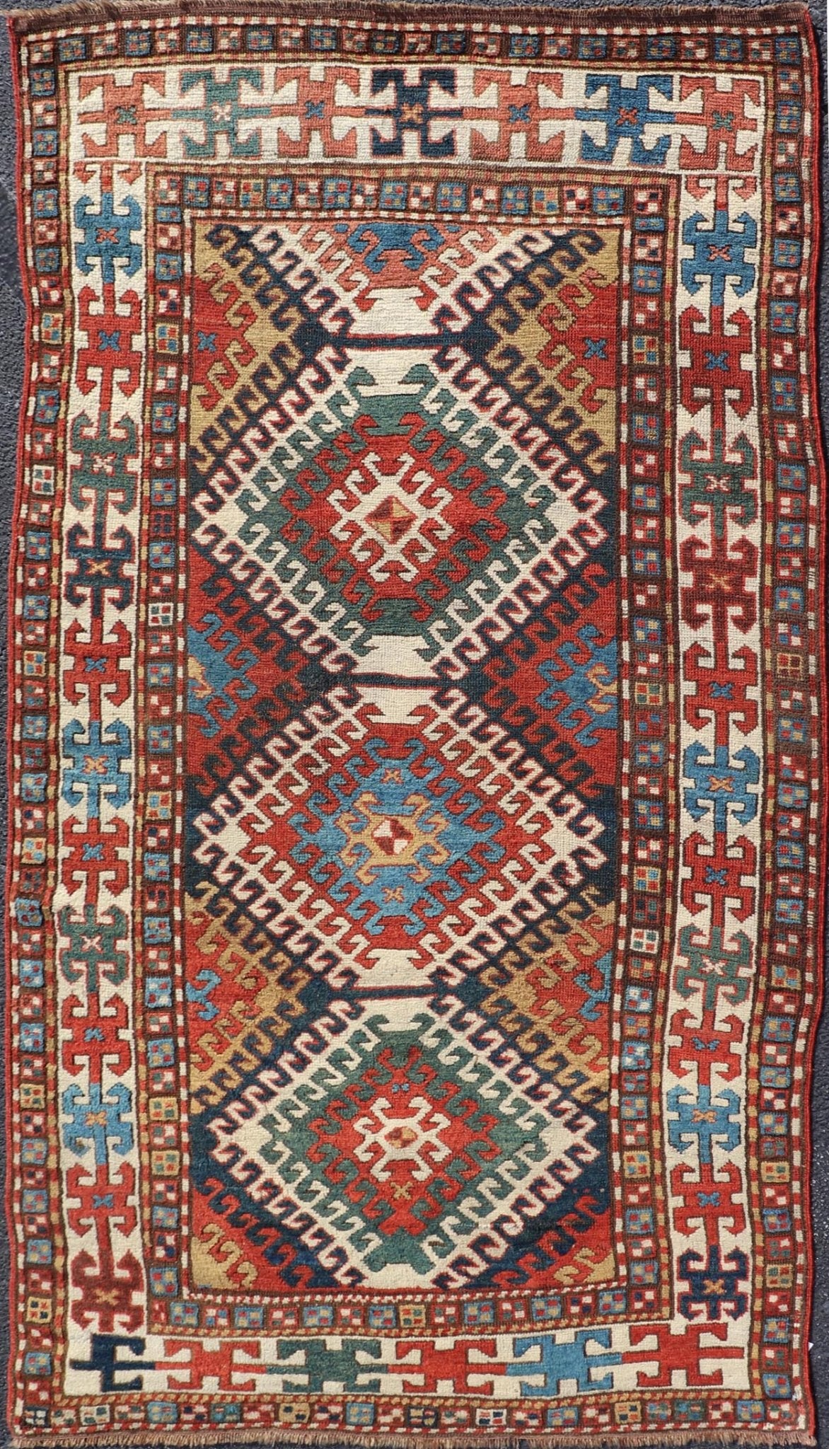 Antique Caucasian Kazak Rug With Geometric Design Medallion's Keivan Woven Arts. Keivan Woven Arts / rug X23 - 1205 - 197, country of origin / type: Caucuses / Caucasian Kazak, circa 1880. Measures: 3'10 x 7'4 Brilliant Kazak rugs are among the most... - Keivan Woven ArtsX23 - 1205 - 197 - 25633Rugs
