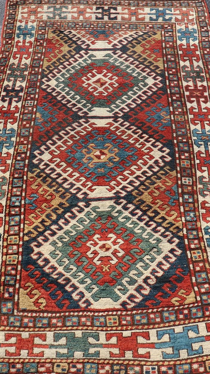 Antique Caucasian Kazak Rug With Geometric Design Medallion's Keivan Woven Arts. Keivan Woven Arts / rug X23 - 1205 - 197, country of origin / type: Caucuses / Caucasian Kazak, circa 1880. Measures: 3'10 x 7'4 Brilliant Kazak rugs are among the most... - Keivan Woven ArtsX23 - 1205 - 197 - 25633Rugs