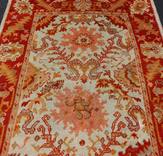 Antique Turkish Oushak with Elegant Motifs in Red, Ivory, Gold and Salmon Pink. Keivan Woven Arts / rug ZBH - 15051, country of origin / type: Turkey / Oushak, circa Early - 20th century Measures: 7 x 9'8. This beautiful antique Turkish Oushak rug fr... - Keivan Woven ArtsZBH - 15051 - 8361Rug