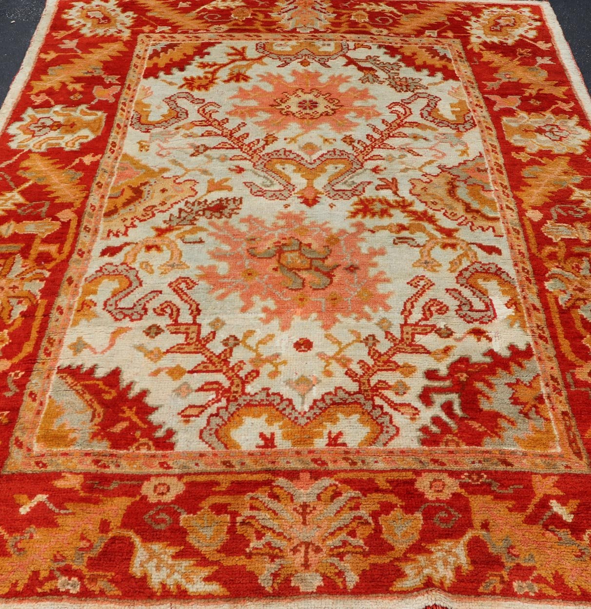 Antique Turkish Oushak with Elegant Motifs in Red, Ivory, Gold and Salmon Pink. Keivan Woven Arts / rug ZBH - 15051, country of origin / type: Turkey / Oushak, circa Early - 20th century Measures: 7 x 9'8. This beautiful antique Turkish Oushak rug fr... - Keivan Woven ArtsZBH - 15051 - 8361