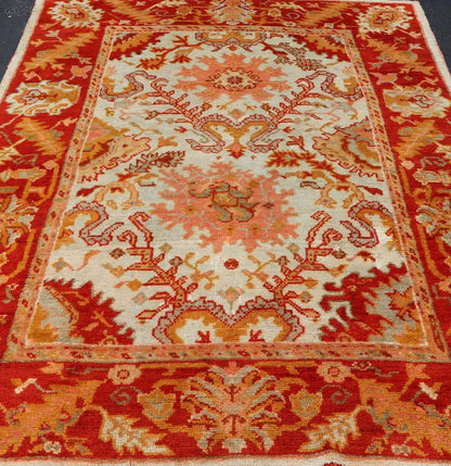Antique Turkish Oushak with Elegant Motifs in Red, Ivory, Gold and Salmon Pink. Keivan Woven Arts / rug ZBH - 15051, country of origin / type: Turkey / Oushak, circa Early - 20th century Measures: 7 x 9'8. This beautiful antique Turkish Oushak rug fr... - Keivan Woven ArtsZBH - 15051 - 8361