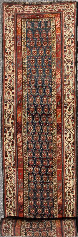 Long Antique Persian Runner - This antique runner was woven in far northwest Persia in the area bordering the Caucasus. The deep madder red color and saturation of its finely drawn elements are enhanced by their placement against a deep indigo field. Th... - Keivan Woven ArtsZBH - 15053 - 8006
