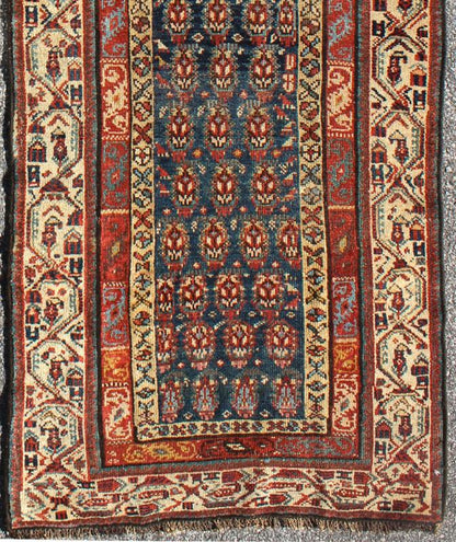 Long Antique Persian Runner - This antique runner was woven in far northwest Persia in the area bordering the Caucasus. The deep madder red color and saturation of its finely drawn elements are enhanced by their placement against a deep indigo field. Th... - Keivan Woven ArtsZBH - 15053 - 8006