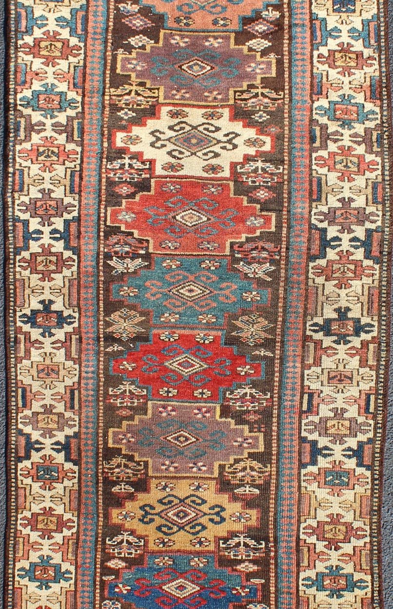 Northwest Persian antique runner with geometric design in multicolored tones, rug zir - 12, country of origin / type: Iran / N.W. Persian Tribal, circa 1900. This jewel - toned antique N.W. Persian rug, circa 1900, features a unique blend of colors ... - Keivan Woven ArtsZIR - 12 - 9396Rug