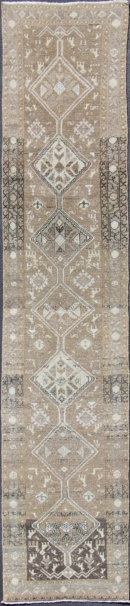 Tribal diamond medallion antique Heriz runner Persian in taupe, camel, brown, rug zir - 20, country of origin / type: Iran / Heriz, circa 1910 This antique Persian Heriz gallery rug, circa early 20th century, features a unique blend of colors and ... - Keivan Woven ArtsZIR - 20 - 10090Rug