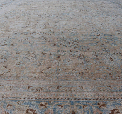 Persian distressed Antique Mashhad Carpet with Muted Floral and Medallion Design. Antique distressed Persian Mashhad carpet with tan and blue floral and medallion design, / ZIR - 51 - KV - 10. Persian Mashhad floral design. This outstanding mu... - Keivan Woven ArtsZIR - 51 - KV - 10 - 14994