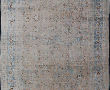 Persian distressed Antique Mashhad Carpet with Muted Floral and Medallion Design. Antique distressed Persian Mashhad carpet with tan and blue floral and medallion design, / ZIR - 51 - KV - 10. Persian Mashhad floral design. This outstanding mu... - Keivan Woven ArtsZIR - 51 - KV - 10 - 14994