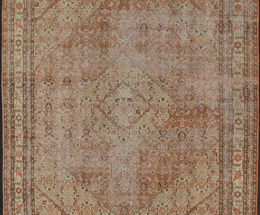 Antique Persian Tabriz with All - Over Medallion Design in Orange and Browns This antique Persian Tabriz rug features an all - over, sub - geometric floral design rendered in off white, orange and brown tones. A complementary, multi - tiered border enco... - Keivan Woven ArtsZIR - 66 - KV - 12 - 15060