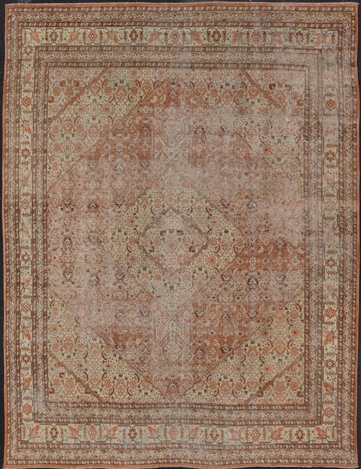 Antique Persian Tabriz with All - Over Medallion Design in Orange and Browns This antique Persian Tabriz rug features an all - over, sub - geometric floral design rendered in off white, orange and brown tones. A complementary, multi - tiered border enco... - Keivan Woven ArtsZIR - 66 - KV - 12 - 15060