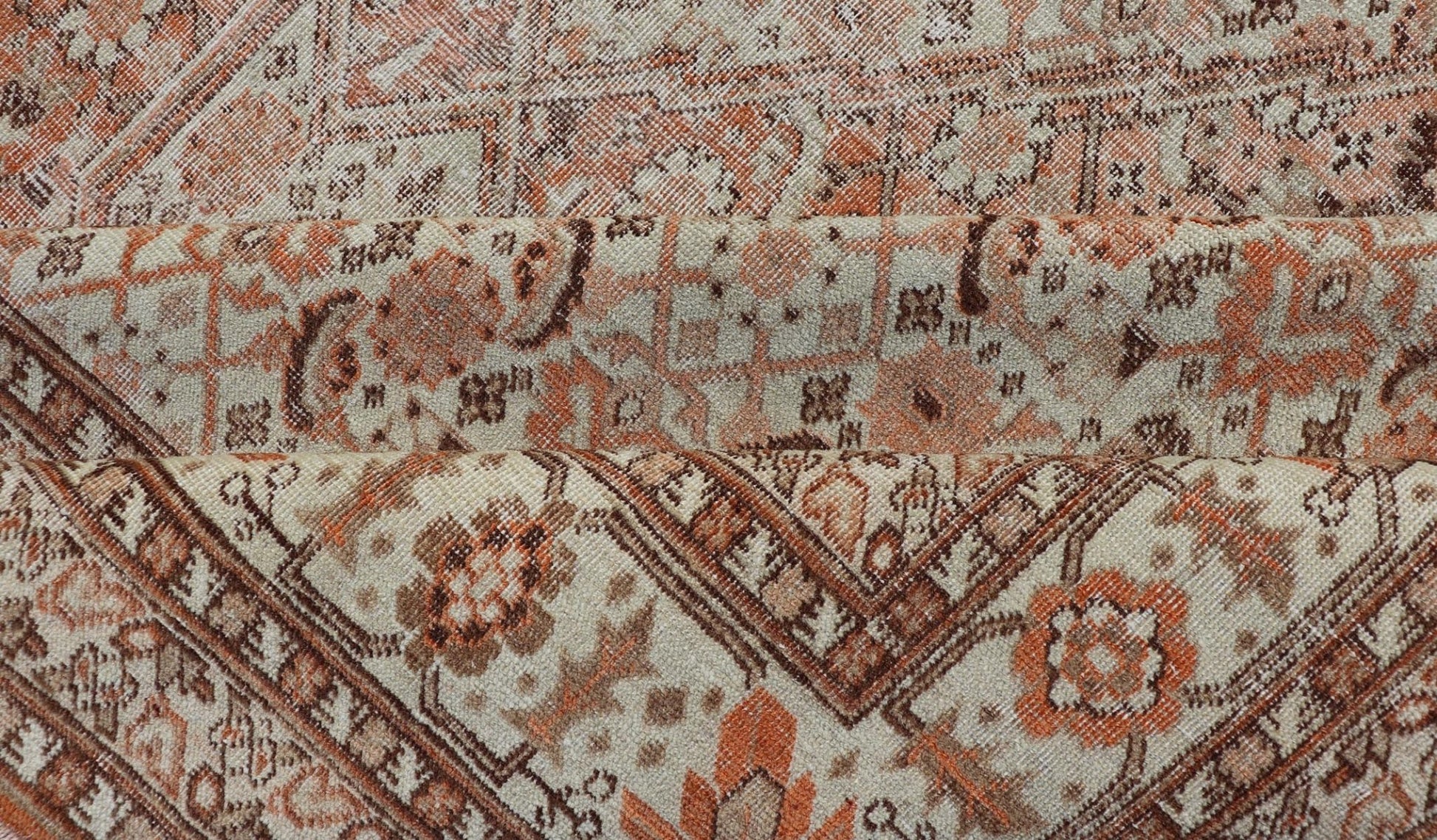 Antique Persian Tabriz with All - Over Medallion Design in Orange and Browns This antique Persian Tabriz rug features an all - over, sub - geometric floral design rendered in off white, orange and brown tones. A complementary, multi - tiered border enco... - Keivan Woven ArtsZIR - 66 - KV - 12 - 15060